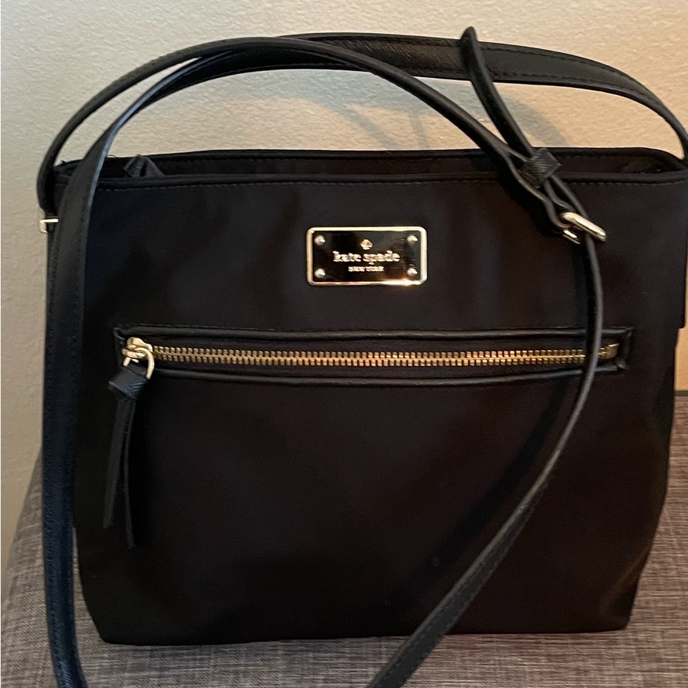 Kate Spade New York
Nylon Crossbody Bag in Black.